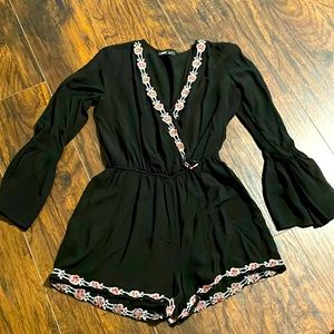 Black mini romper with embroidery detail